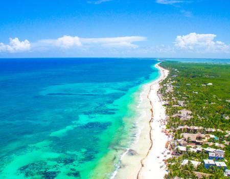 Tulum Beach Quintana Roo aerial view of turqouise waters and white sand beaches along a lush green landscape